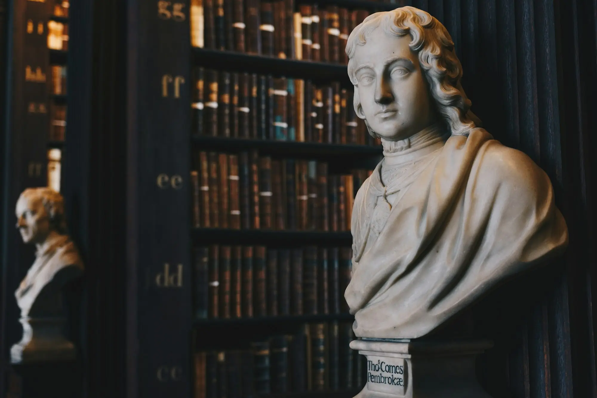 A reading room lined with bound volumes.