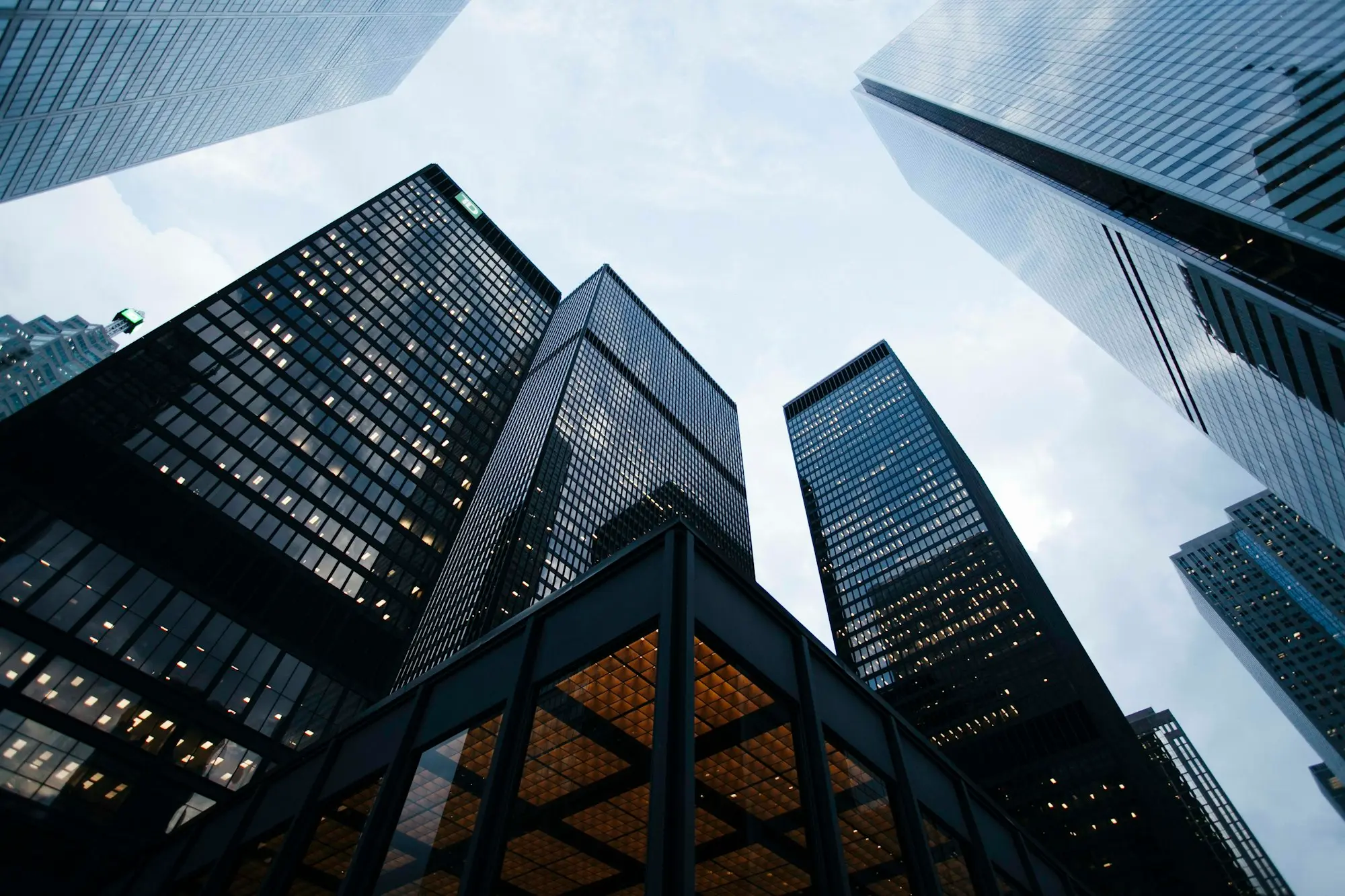 Office towers seen from street level, looking up.